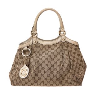 Bolsa Gucci Sukey GG Supreme e Verniz Bege