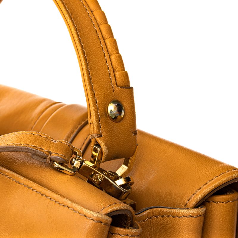 Bolsa-Paula-Cademartori-Dun-Dun-Couro-Caramelo-e-Spikes