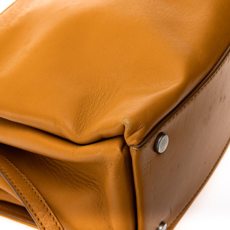 Bolsa-Paula-Cademartori-Dun-Dun-Couro-Caramelo-e-Spikes
