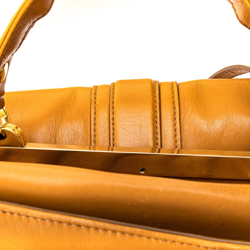 Bolsa-Paula-Cademartori-Dun-Dun-Couro-Caramelo-e-Spikes