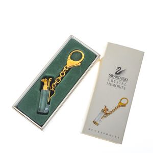 Chaveiro Swarovski Golf Dourado